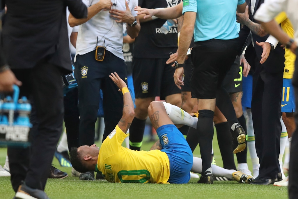 Brazil's Neymar gestures on the ground during the round of 16 match between Brazil and Mexico at the 2018 soccer World Cup in the Samara Arena, in Samara, Russia, Monday, July 2, 2018. (AP Photo/Thanassis Stavrakis)