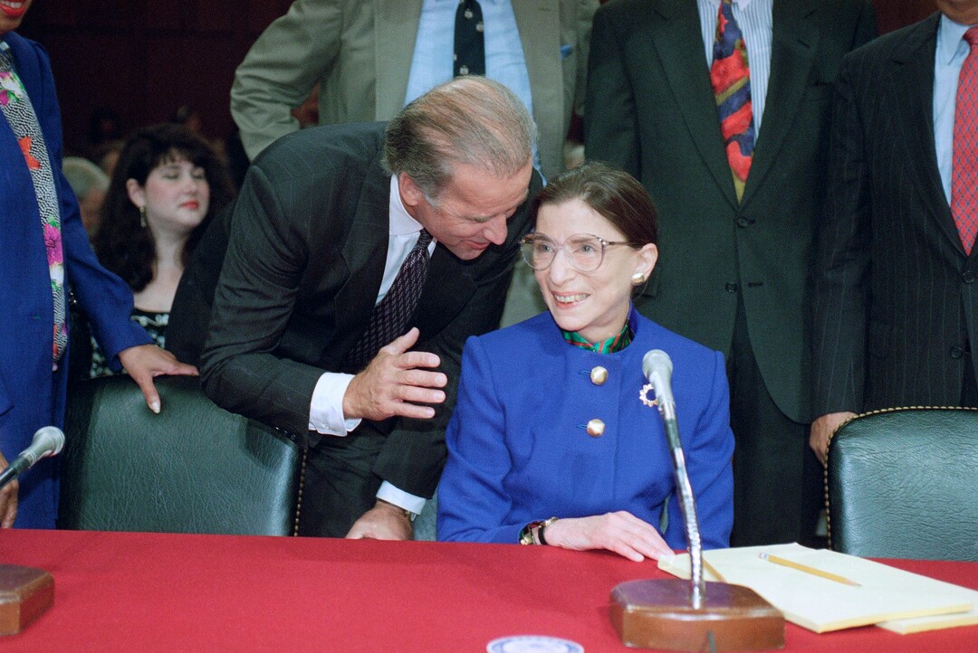 FILE - In this July 20, 1993, file photo, then-Sen. Joseph Biden, D-Del., chairman of the Senate Judiciary Committee, talks to Supreme Court nominee Judge Ruth Bader Ginsburg prior to the start of her confirmation hearing before the committee on Capitol Hill in Washington.The Supreme Court says Ginsburg has died of metastatic pancreatic cancer at age 87.  (AP Photo/John Duricka, File)