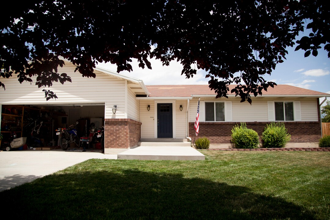 (Stella Yu |  The Salt Lake Tribune) The 2,713-square-foot rambler home in South Jordan includes five bedrooms, three and a half baths, two family rooms, a fireplace, a kitchen, a bar and a semi-formal dining room. A two-car garage is attached to the house with outdoor RV parking space.