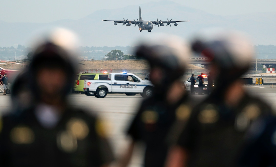 (Steve Griffin  |  Deseret News, pool photo)  A  C130-J carrying the  casket of Draper Battalion Chief Matt Burchett prepares to landa at the Utah Air National Guard Base in Salt Lake City on Wednesday, Aug. 15, 2018. Burchett was killed while fighting the Mendocino Complex Fire north of San Francisco.
