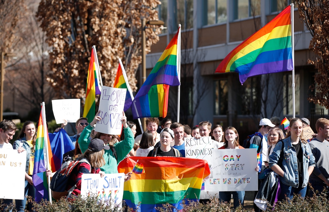 (George Frey  |  special to The Salt Lake Tribune) BYU students and others gather in front of the Ernest L. Wilkinson Student Center on the campus of Brigham Young University to protest BYUÕs rollback of a newly announced policy change on LGBTQ students on March 5, 2020 in Provo, Utah.