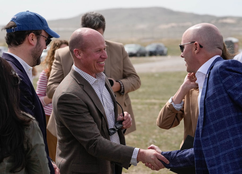 (Francisco Kjolseth | The Salt Lake Tribune) Joel Ferry, executive director of the Department of Natural Resources, shakes hands with Gov. Spencer Cox in Tooele county where they discussed opportunities in nuclear earlier this year. Ferry will leave his post in August.