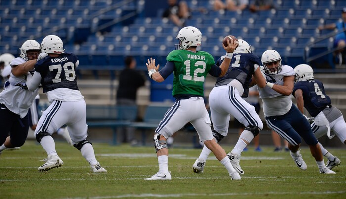 (Francisco Kjolseth  |  The Salt Lake Tribune)  Quarterback Tanner Mangum spots his receiver as BYU holds a scrimmage at LaVell Edwards Stadium in Provo on Thursday, Aug. 10, 2017.