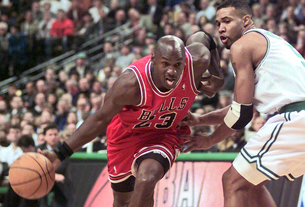 (Associated Press file photo) Chicago Bulls guard Michael Jordan, shown in a 1997 game, has long blamed an allegedly tainted pizza from a Utah restaurant for getting him sick prior to his legendary "Flu Game" in the ’97 Finals. Utah Jazz analyst Holly Rowe, however, believes he got food poisoning from something eaten off a craft services table at the arena.