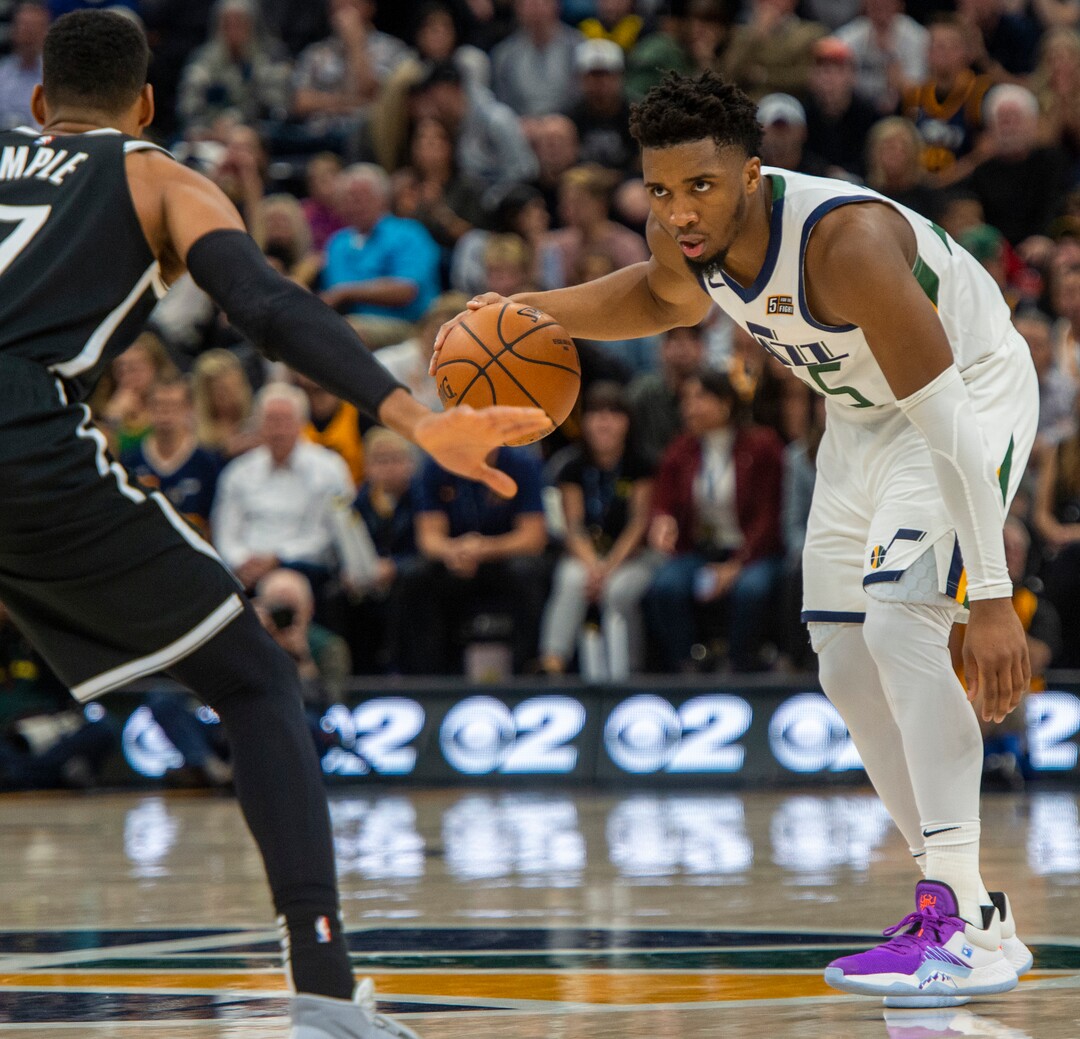 (Rick Egan  |  The Salt Lake Tribune)        Utah Jazz guard Donovan Mitchell (45) runs some time off the clock, as Brooklyn Nets guard Garrett Temple (17) defends, in NBA basketball action between the Utah Jazz and the Brooklyn Nets in Salt Lake City, Tuesday, Nov 12, 2019.