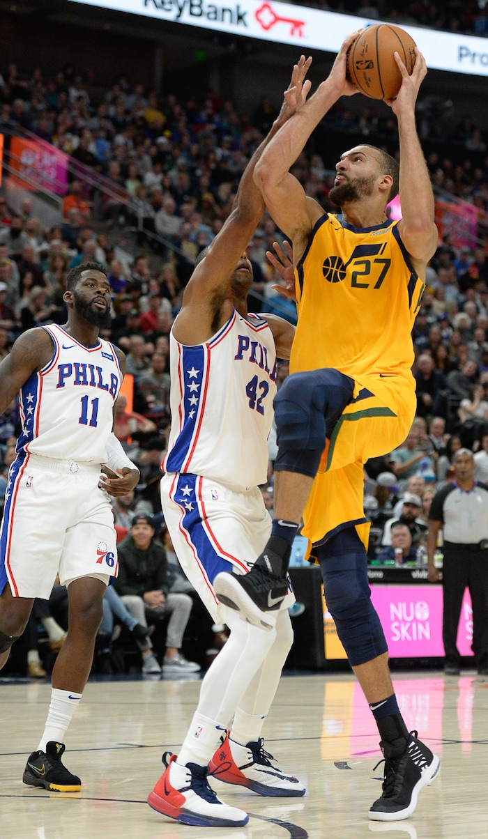 (Francisco Kjolseth  |  The Salt Lake Tribune)  Utah Jazz center Rudy Gobert (27) pushes past Philadelphia 76ers forward Al Horford (42) as the Utah Jazz host the Philadelphia 76ers in their NBA basketball game at Vivint Smart Home Arena in Salt Lake City on Wednesday, Nov. 6, 2019.