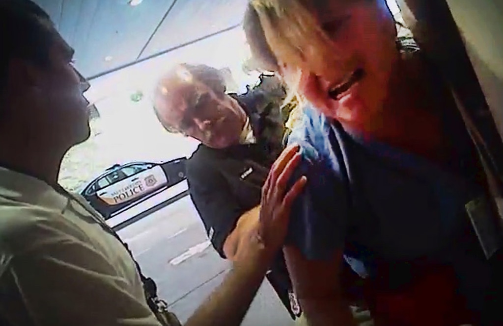 FILE - In this July 26, 2017, frame grab from video taken from a police body camera and provided by attorney Karra Porter, nurse Alex Wubbels is arrested by a Salt Lake City police officer at University Hospital in Salt Lake City. Utah Police Detective Jeff Payne was fired Tuesday, Oct. 10, 2017, in a case that became a flashpoint in the ongoing national conversation about police use of force. (Salt Lake City Police Department/Courtesy of Karra Porter via AP, File)