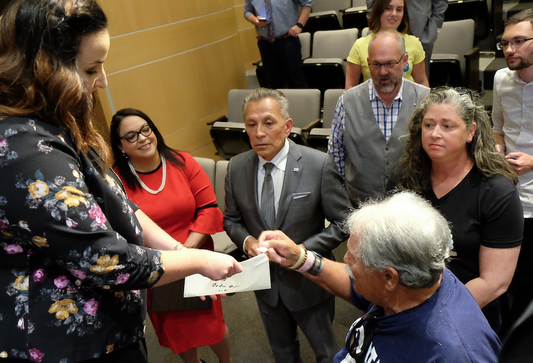 (Francisco Kjolseth  |  The Salt Lake Tribune)  Debate moderator Averie Vockel, left, has candidates for Salt Lake City mayor pick their order of introduction as they gather for a debate at the Salt Lake City Library on Wed. June 26, 2019. The debate was hosted by the ABU Education Fund and the University of UtahÕs John R. Park Debate Society and moderated by Averie Vockel.