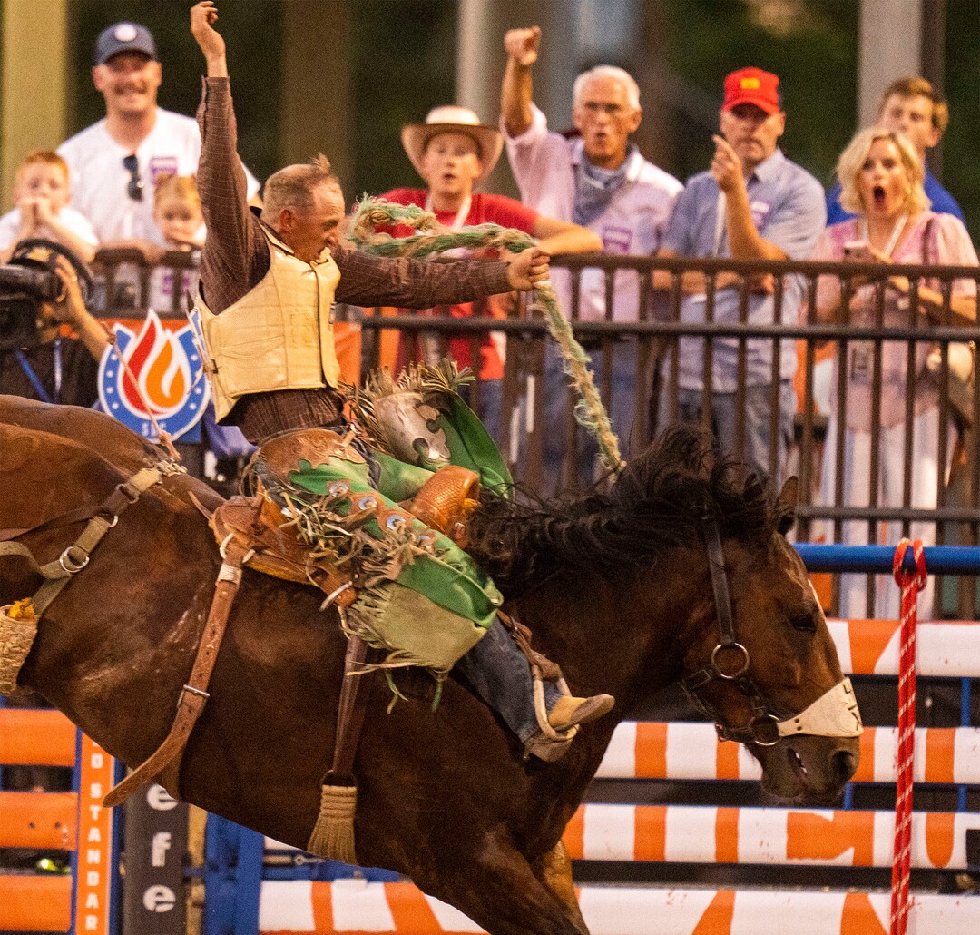 (Rick Egan | The Salt Lake Tribune)  Alan Boore competes in saddle bronc at the Utah Days of '47 Rodeo at the State Fairpark, on Monday, July 25, 2022.