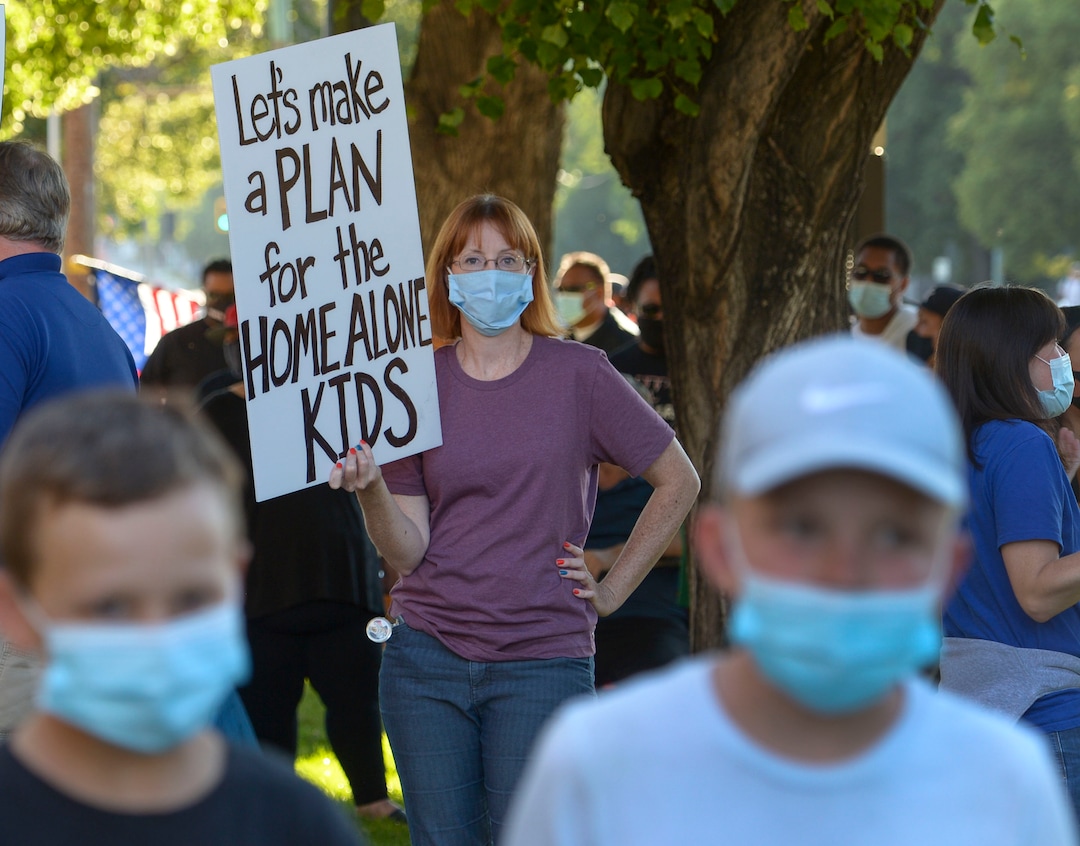 (Leah Hogsten  |  The Salt Lake Tribune) Sabreena Elggren is worried for the underprivileged kids and students who are immigrants and refugees if SLCSD decides to not hold in-person classes this year. Parents and students within the Salt Lake City School District rally for K-12 students to return in-person to school this fall, July 15, 2020.