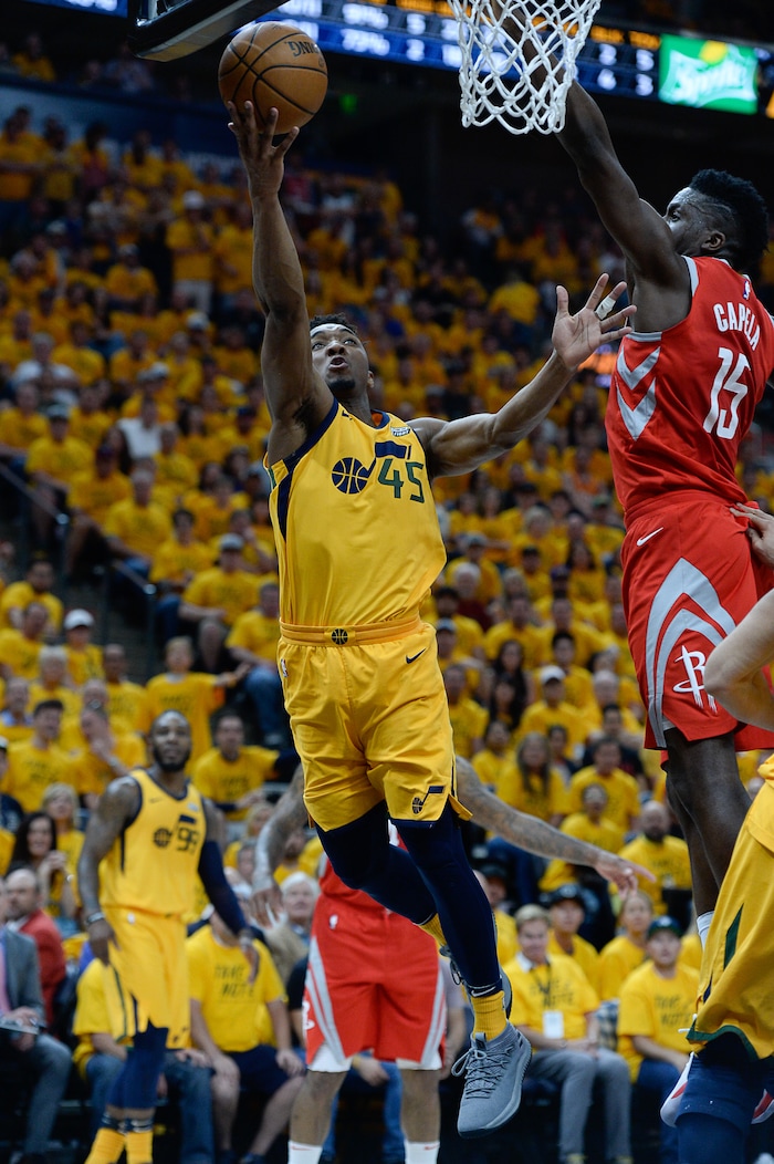 (Francisco Kjolseth | The Salt Lake Tribune) Utah Jazz guard Donovan Mitchell (45) drives the ball past the Houston Rockets in Game 4 of the NBA playoffs at the Vivint Smart Home Arena Sunday, May 6, 2018 in Salt Lake City.