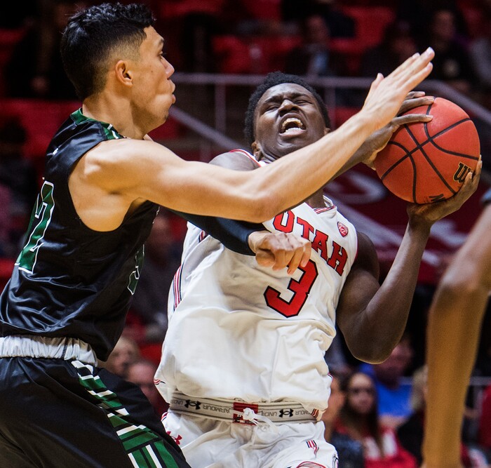 (Rick Egan  |  The Salt Lake Tribune)  Utah Utes forward Donnie Tillman (3) tries to get past Hawaii Warriors guard Drew Buggs (1), in basketball action, Utah Utes vs Hawaii Warriors, at the Jon M. Huntsman Center, Saturday, December 2, 2017.