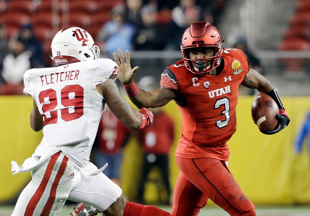 Utah quarterback Troy Williams (3) runs next to Indiana linebacker Dawson Fletcher during the second half of the Foster Farms Bowl NCAA college football game Wednesday, Dec. 28, 2016, in Santa Clara, Calif. Utah won 26-24. (AP Photo/Marcio Jose Sanchez)