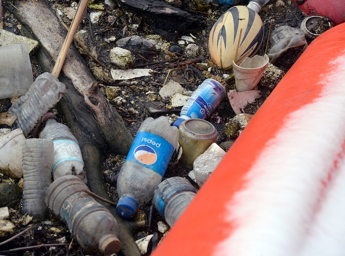 (Al Hartmann | The Salt Lake Tribune)
Booms along the Jordan RIver at about 1700 West and Center Street in North Salt Lake are collecting trash, especially plastic that makes its way down the Jordan River and into the Great Salt Lake where it kills birds. The Natiure Conservency worked with Salt Lake County and private landowners to install the trash-catching booms. They can then be manually cleaned before it reaches the lake.