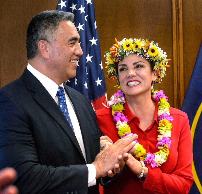 (Steve Griffin | The Salt Lake Tribune) Michelle Kaufusi smiles at her husband Steve Kaufusi after taking the Oath of Office, administered by Judge Vernon Romeny, as she becomes the first female mayor in Provo city's history. The small private ceremony was held in the Mayor's Office in Provo Tuesday January 2, 2018. A public Inauguration Ceremony for Mayor Kaufusi will be held at the Provo Library on January 18, 2018.
