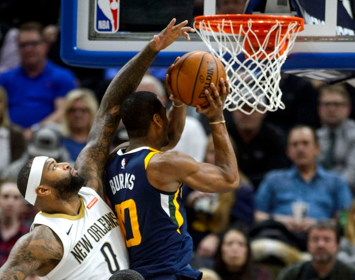 (Steve Griffin  |  The Salt Lake Tribune) Utah Jazz guard Alec Burks (10) gets past New Orleans Pelicans center DeMarcus Cousins (0) for a basket during the the Utah Jazz versus the New Orleans Pelicans NBA basketball game at the Vivint Smart Home Arena in Salt Lake City Wednesday January 3, 2018.