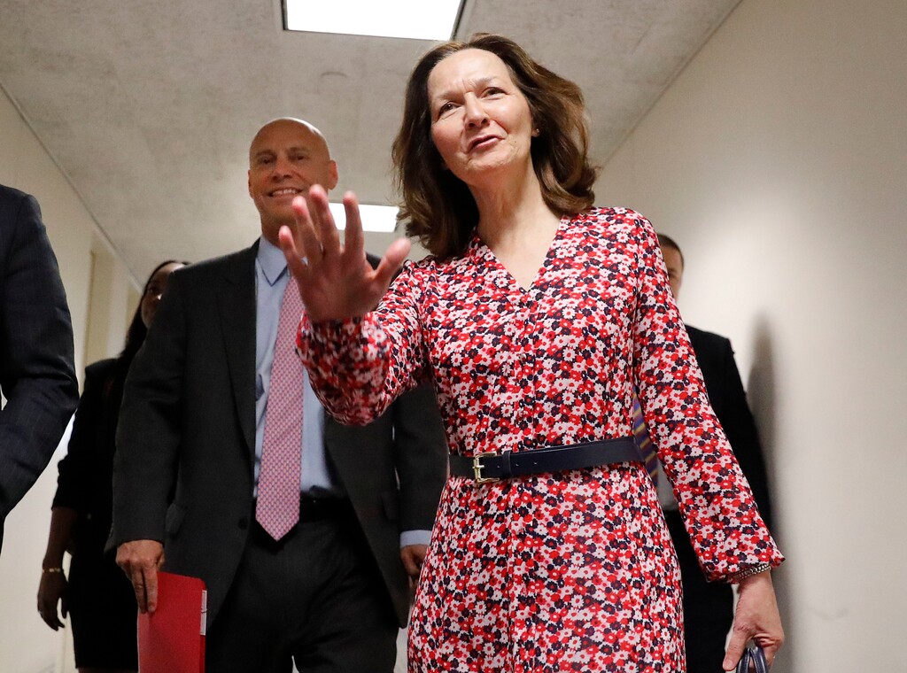 CIA Director nominee Gina Haspel waves as she arrives for her meeting with Sen. Joe Manchin, D-W.Va., on Capitol Hill in Washington, Monday, May 7, 2018. Walking with her is White House legislative affairs director Marc Short, left. (AP Photo/Pablo Martinez Monsivais)
