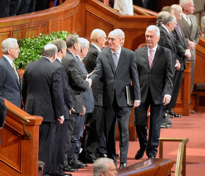 (Al Hartmann  |  The Salt Lake Tribune) 	
President Henry B. Eyring, center, shake hands with Members of the Qurom of the 12 Apostles at the start of General Conference Sunday Oct. 1 2017. 