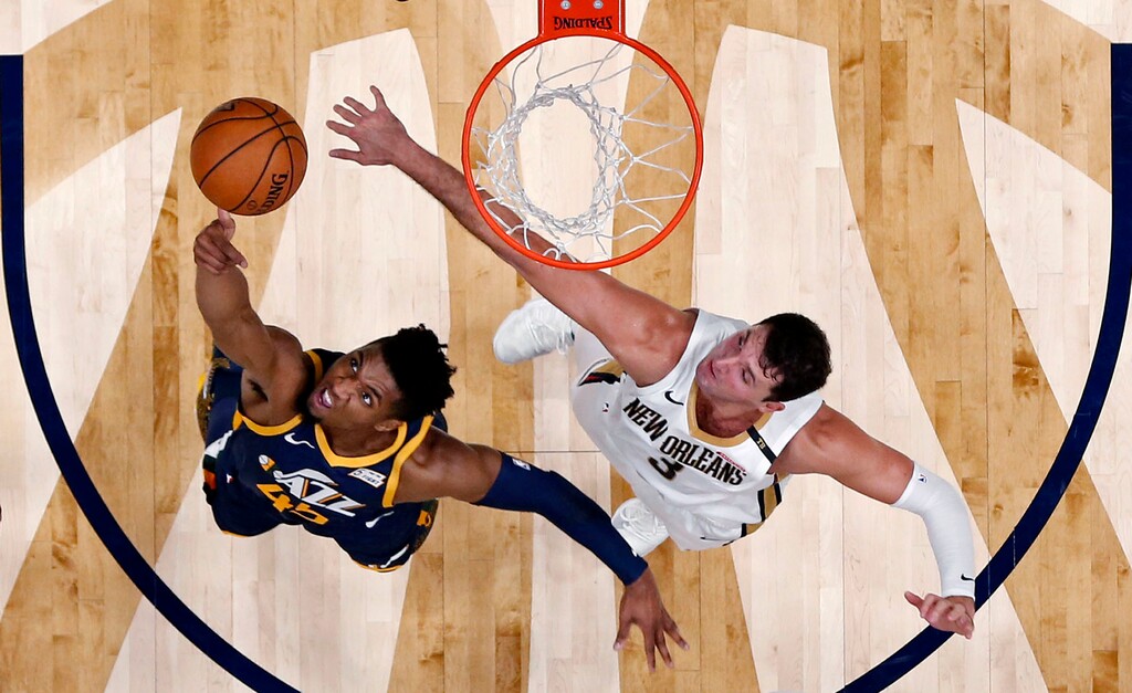 Utah Jazz guard Donovan Mitchell (45) goes to the basket against New Orleans Pelicans forward Nikola Mirotic (3) in the first half of an NBA basketball game in New Orleans, Saturday, Oct. 27, 2018. (AP Photo/Gerald Herbert)