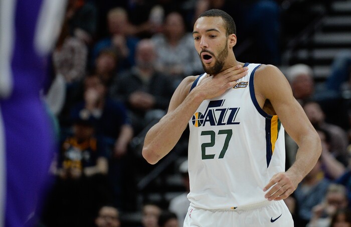 (Francisco Kjolseth  |  The Salt Lake Tribune)  Utah Jazz center Rudy Gobert (27) feels the effects of being hit in the throat by a Kings defender as the Utah Jazz host the Sacramento Kings in their NBA game at Vivint Smart Home Arena Friday, April 5, 2019, in Salt Lake City.