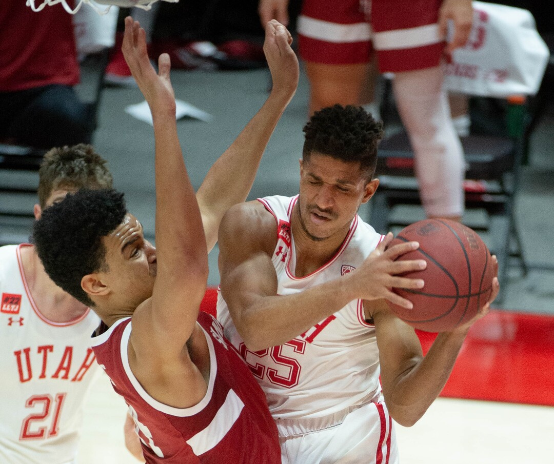 (Francisco Kjolseth  | The Salt Lake Tribune) Utah Utes guard Alfonso Plummer (25) tries to get past Stanford Cardinal forward Spencer Jones (14) as the Utes host the Stanford Cardinals on Thursday, Jan. 14, 2021 at the Jon M. Huntsman Center in Salt Lake City.