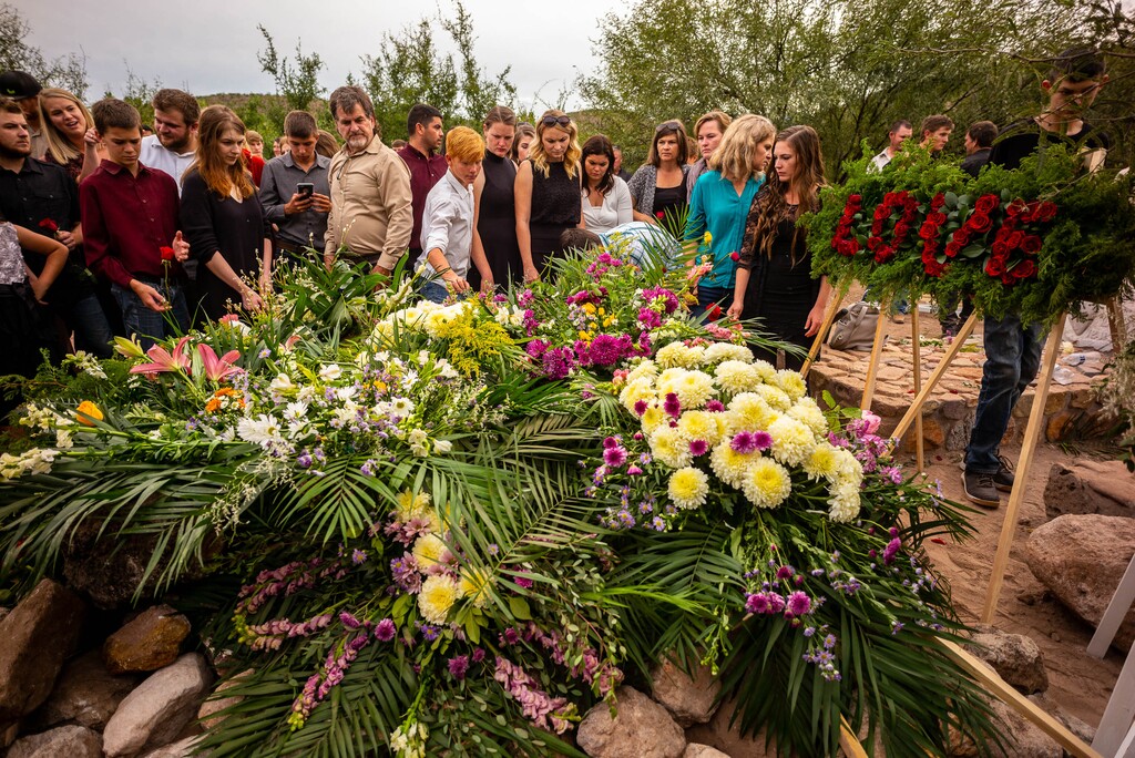 (Trent Nelson  |  The Salt Lake Tribune)
Family members put flowers on the grave after the funeral for Dawna Langford and two of her children, Trevor and Rogan, in La Mora, Sonora on Thursday Nov. 7, 2019.