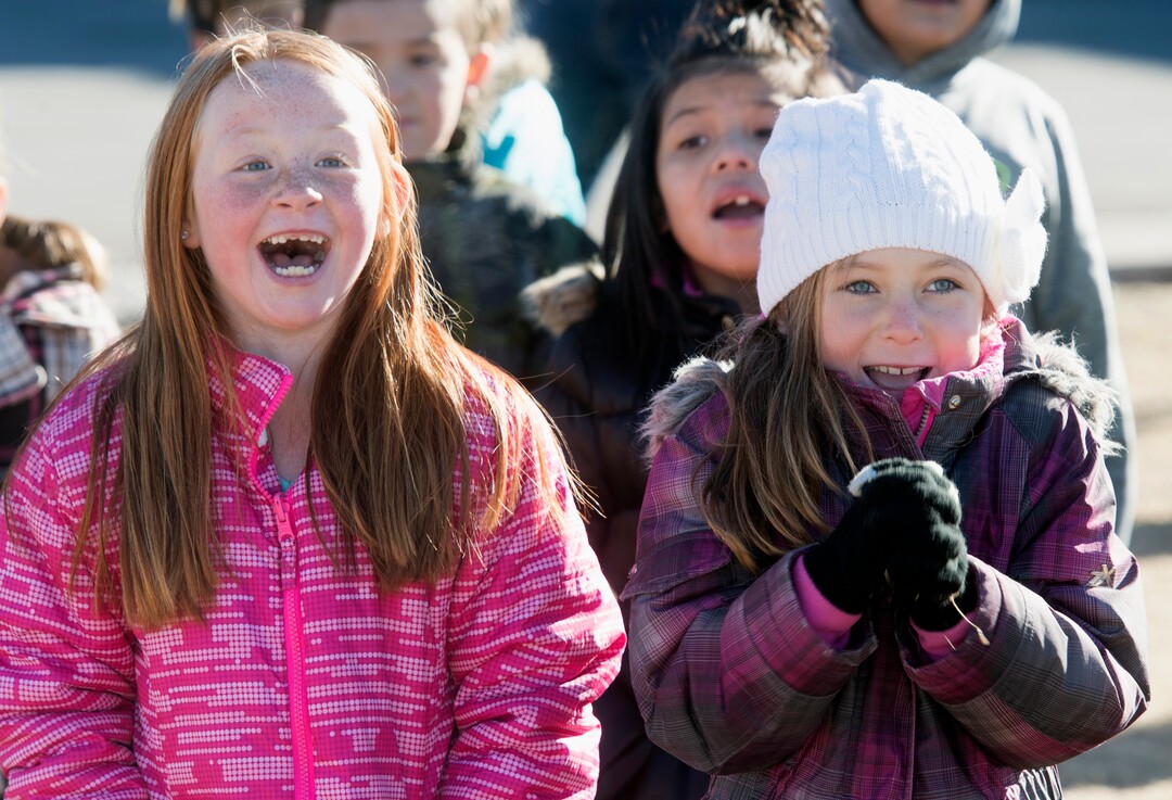 (Rick Egan  |  The Salt Lake Tribune) First graders Jaxie Marx and Rebecca Marshall react as Santa and Mrs Claus arrive in a helicopter, at Centennial Elementary School, in Roosevelt, Utah, as volunteer pilots from the Utah Wing of Angel Flight West,  brought school supplies and gifts to students  on their annual Santa Flight. Friday, December 8, 2017.