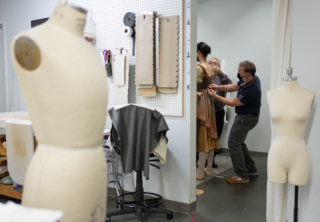 (Francisco Kjolseth | The Salt Lake Tribune) David Heuvel, right, the retiring director of costume production at Ballet West, is joined by Jason Hadley who is taking over the role, as they work with a ballet dancer for a fitting in preparation for an upcoming performance of Romeo and Juliet by Ballet West on Thursday, Feb. 3, 2022.
