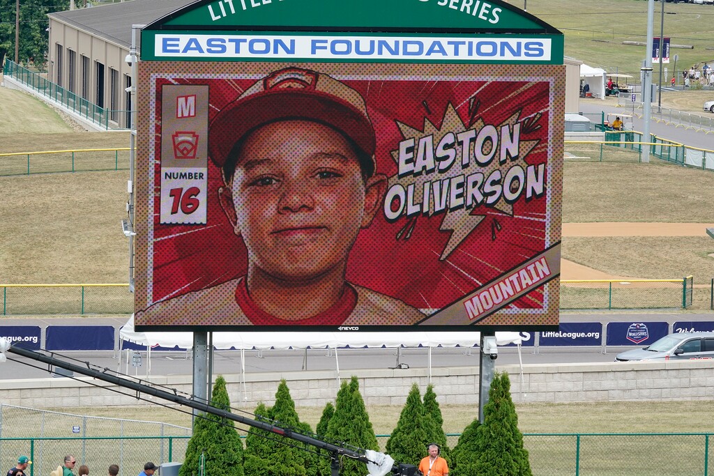 (Gene J. Puskar | AP) A picture of Mountain Region Champion Little League team member Easton Oliverson, from Santa Clara, is shown on the scoreboard at Volunteer Stadium during the opening ceremony of the 2022 Little League World Series baseball tournament in South Williamsport, Pa., Wednesday, Aug 17, 2022. Oliverson was injured when he fell out of a bunk bed at the dormitory complex.