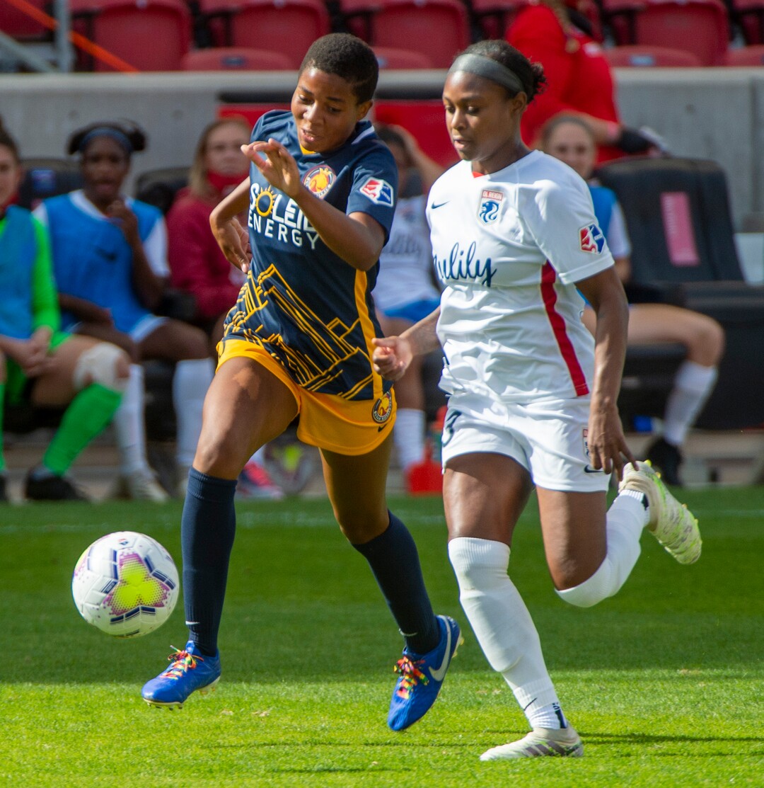 (Rick Egan  |  The Salt Lake Tribune) Utah Royals FC defender Becca Moros (3) races OL Reign FC defender Taylor Smith (23) for the ball, in soccer action between Utah Royals FC and Ol Reign FC at Rio Tinto Stadium in Sandy, Saturday, Sept. 26, 2020.