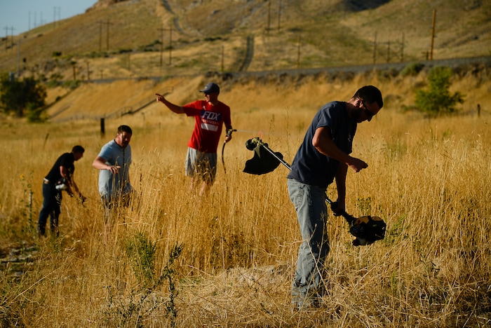 (Francisco Kjolseth  |  The Salt Lake Tribune)  Crews battle a grass fire in Tooele county being dubbed the Green Ravine fire as it burns on Tuesday, Sept. 3, 2019.