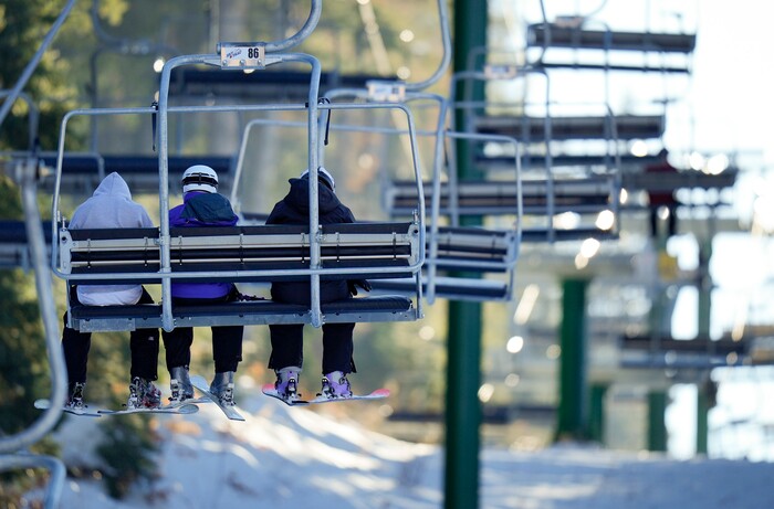 (Bethany Baker | The Salt Lake Tribune) Three skiers ride the lift at Sundance Resort near Provo on Thursday, Dec. 14, 2023.