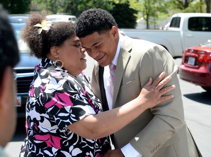Al Hartmann  |  The Salt Lake TribuneMissionaries have just enough time to unload their luggage and hug their family members goodbye at the Missionary Training Center in Provo Wednesday July 26. Elder Gene Taka from Portlland,  originally from Tonga hugs his Aunt Selita Banks goodbye. 