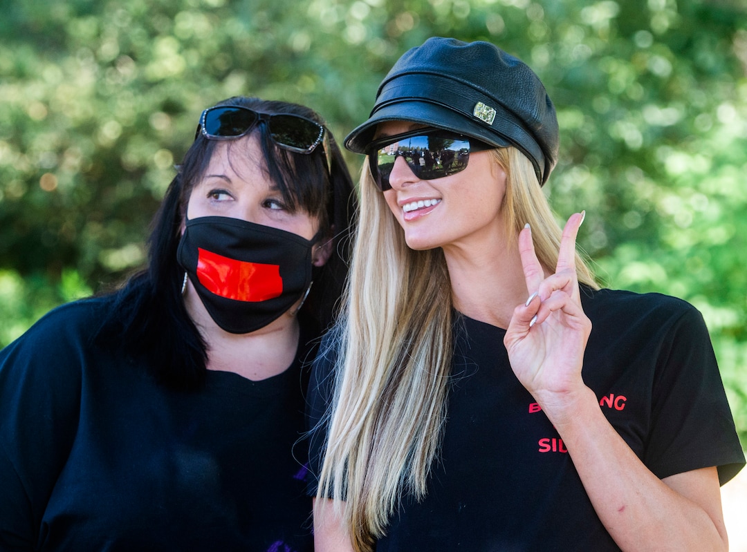 (Rick Egan  |  The Salt Lake Tribune)    Heather Borrero has her photo taken with Paris Hilton, during a rally calling for the closure of Provo Canyon School, a residential treatment center in Utah she attended when she was a teen, on Friday, Oct. 9, 2020.