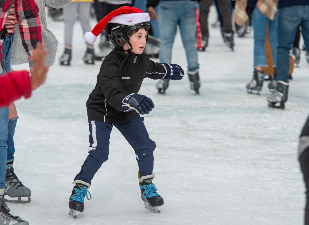 (Rick Egan  |  The Salt Lake Tribune) Evelyn Lambson, 8, of Stansbury Park, takes a break from hockey practice as she skates at the Gallivan Center ice rink on Christmas Eve, Tuesday, Dec. 24, 2019.