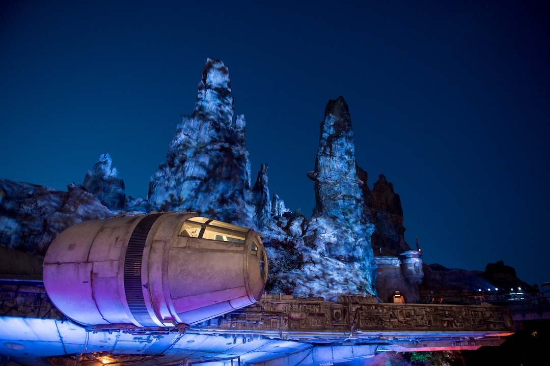 (Jeremy Harmon  |  The Salt Lake Tribune) The Millennium Falcon and the rest of Black Spire Outpost is bathed in eerie blue light after the sun set over at Star Wars: Galaxy's Edge in Anaheim, Ca. on Wednesday, May 29, 2019.