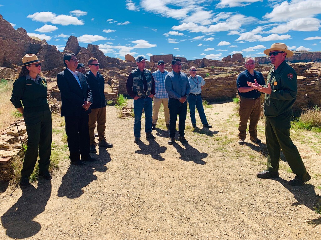 (Jared Touchin/Navajo Nation via AP) In this photo provided by the Navajo Nation, Nathan Hatfield, chief of interpretation at Chaco Culture National Historical Park, speaks to Interior Secretary David Bernhardt, tribal leaders and others during a tour Tuesday, May 28, 2019 at the site about 95 miles northeast of Gallup, New Mexico.