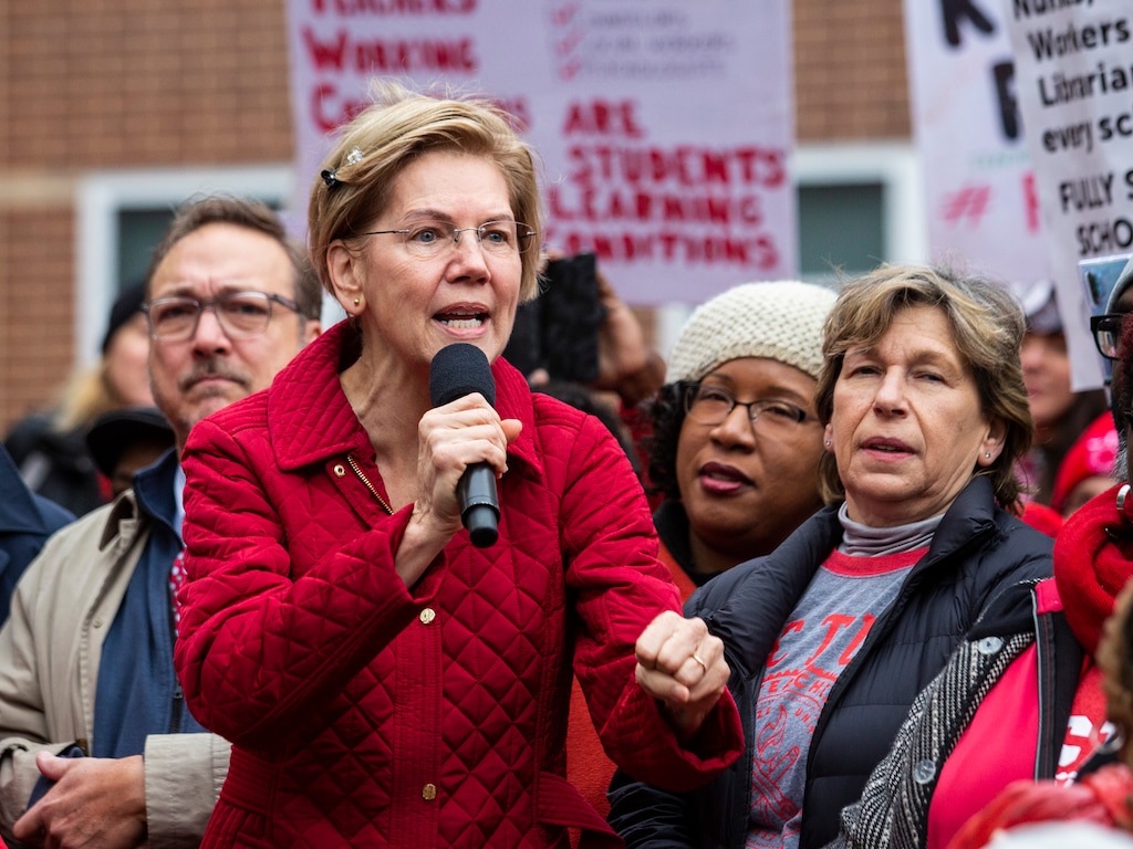 (Ashlee Rezin Garcia | Chicago Sun-Times via AP) Presidential candidate U.S. Sen. Elizabeth Warren, D-Mass., joins striking Chicago Teachers Union and SEIU Local 73 members for a speech on the picket line outside Oscar DePriest Elementary School on the West Side on Tuesday, Oct. 22, 2019.
