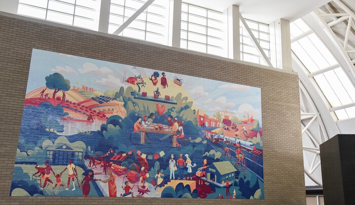 (Francisco Kjolseth  |  The Salt Lake Tribune) Salt Lake City Mayor Jackie Biskupski and Salt Lake County Mayor Jenny Wilson help reveal and dedicate a new legacy mural on Monday, Dec. 30, 2019, placed at the Salt Palace to commemorate the 68thÊUnited Nations Civil Society Conference which took place in Salt Lake City in August. The mural was created by Tooele based Digital Gravy which specializes in 2D design-based animation.