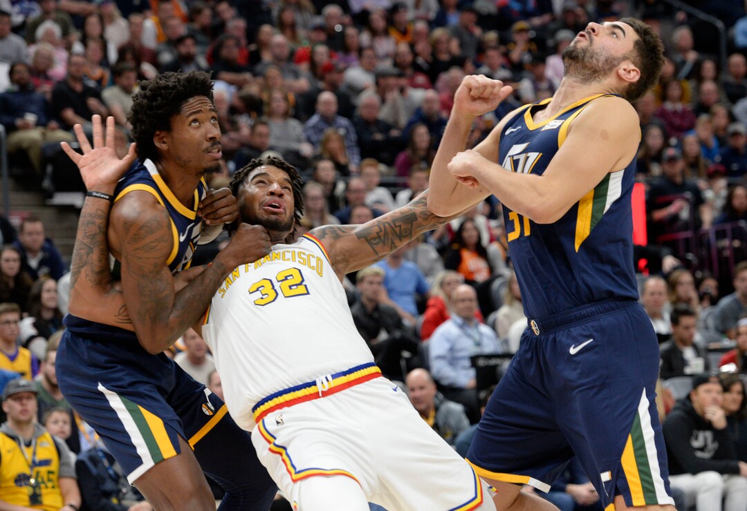 (Leah Hogsten  |  The Salt Lake Tribune) Utah Jazz center Ed Davis (17) fouls Golden State Warriors forward Marquese Chriss (32) as the Utah Jazz defeated the Golden State Warriors, 114-106, Dec. 13, 2019 at Vivint Arena.