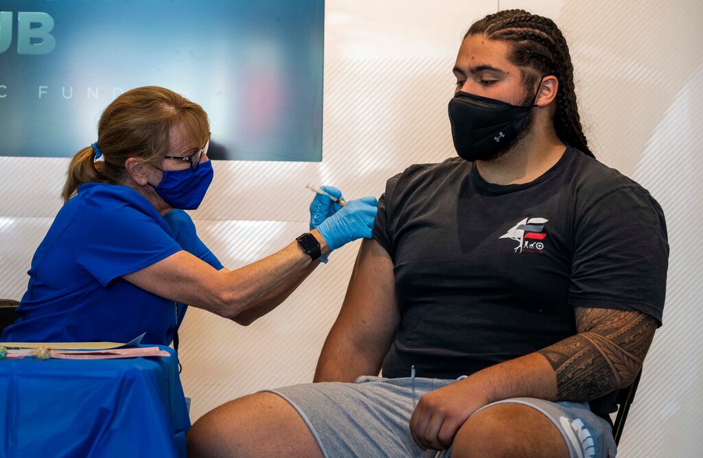 (Rick Egan | The Salt Lake Tribune) Games and booths are set up creating a party atmosphere, at the Spence and Cleone Eccles Football Center, at the Vaccination clinic at the University of Utah, Tuesday, June 29, 2021.