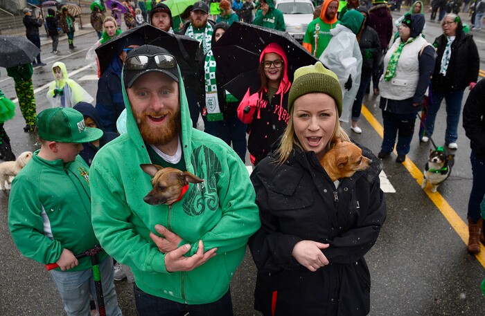 (Scott Sommerdorf | The Salt Lake Tribune) Marchers warm pets during the 40th annual Salt Lake City St. Patrick's Day Parade on Saturday, March 17, 2018.