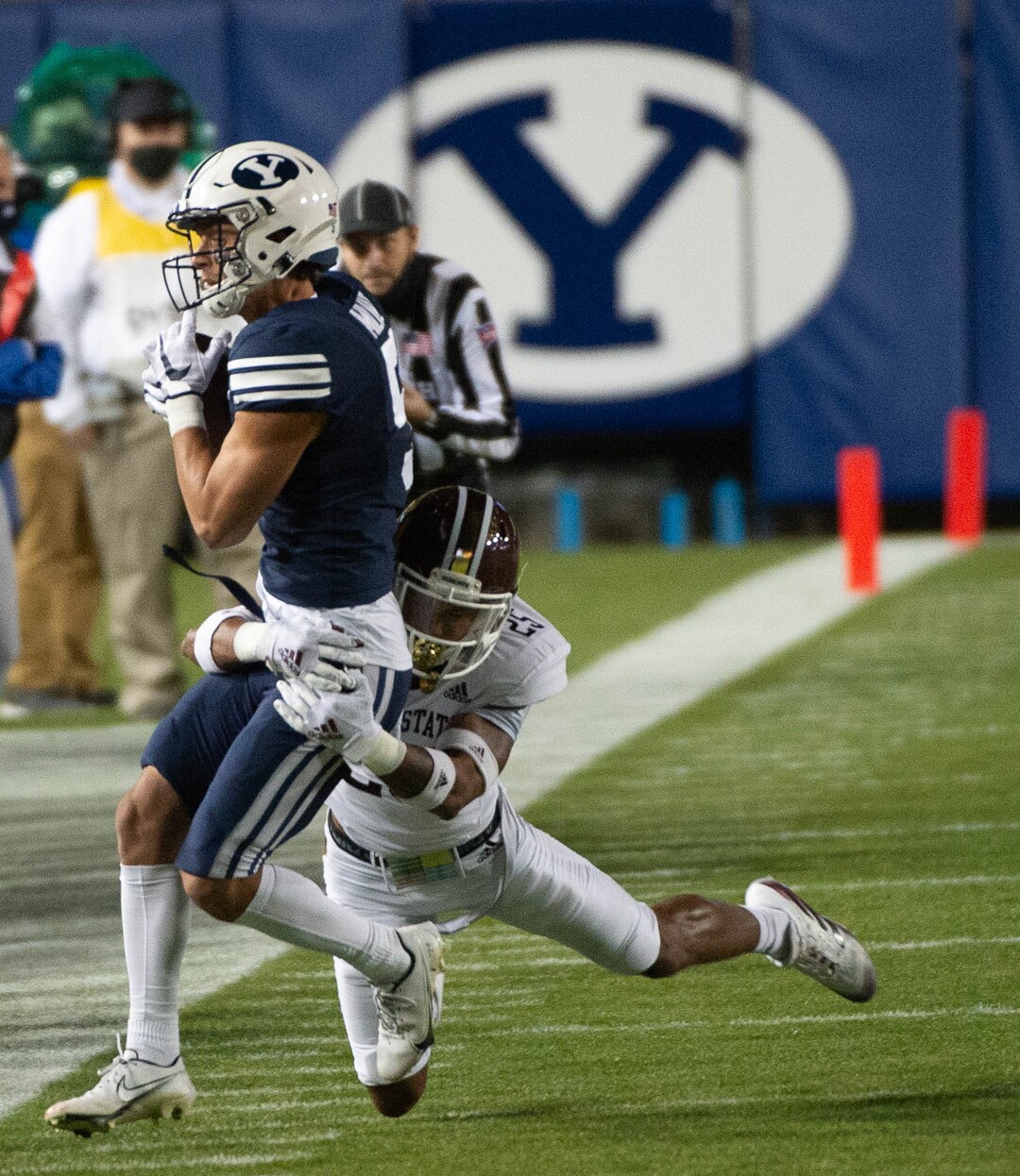 (Francisco Kjolseth  |  The Salt Lake Tribune) Brigham Young Cougars wide receiver Dax Milne (5) is pushed out of bounds by Texas State Bobcats safety Brendon Luper (25) as BYU takes on Texas State during an NCAA college football game at LavVell Edwards Stadium, Saturday, oct. 24, 2020, in Provo, Utah.
