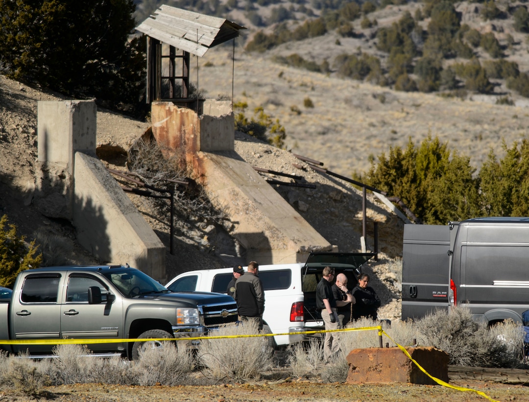 (Steve Griffin  |  The Salt Lake Tribune) Law enforcement officials wait to load two bodies into the Medical Examiners truck after they were recovered from an abandoned mine in UtahÕs west desert near Eureka Wednesday March 28, 2018. Police believe the bodies are those of two teenagers who have been missing for nearly three months. in  Wednesday March 28, 2018.