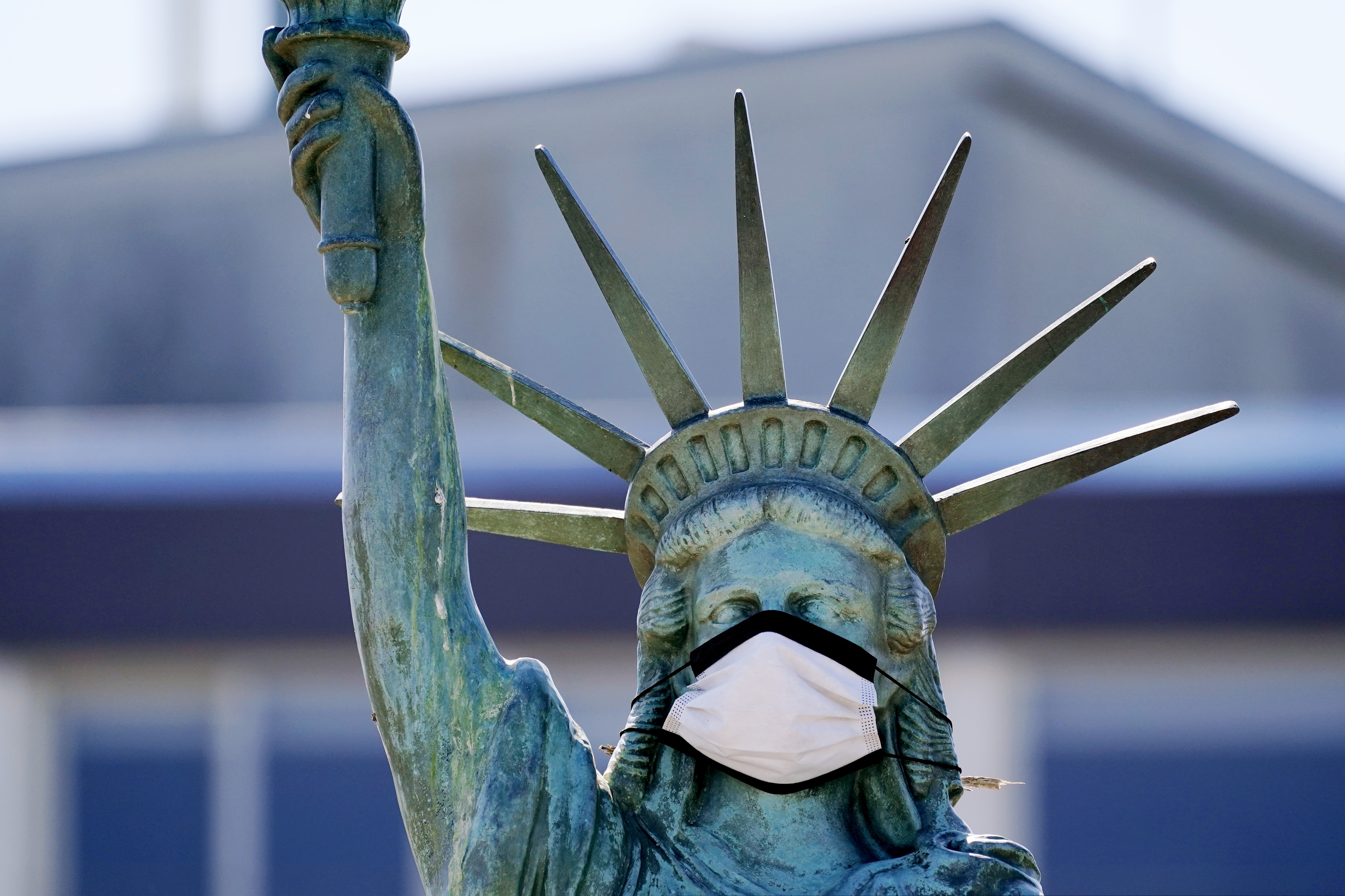 (AP Photo/Elaine Thompson)
In this Aug. 26, 2020, photo, the face on a replica of the Statue of Liberty covers with a protective face mask against the coronavirus. The 1/18th scale replica on Seattle's Alki Beach was erected in 1952 and recast in 2006.