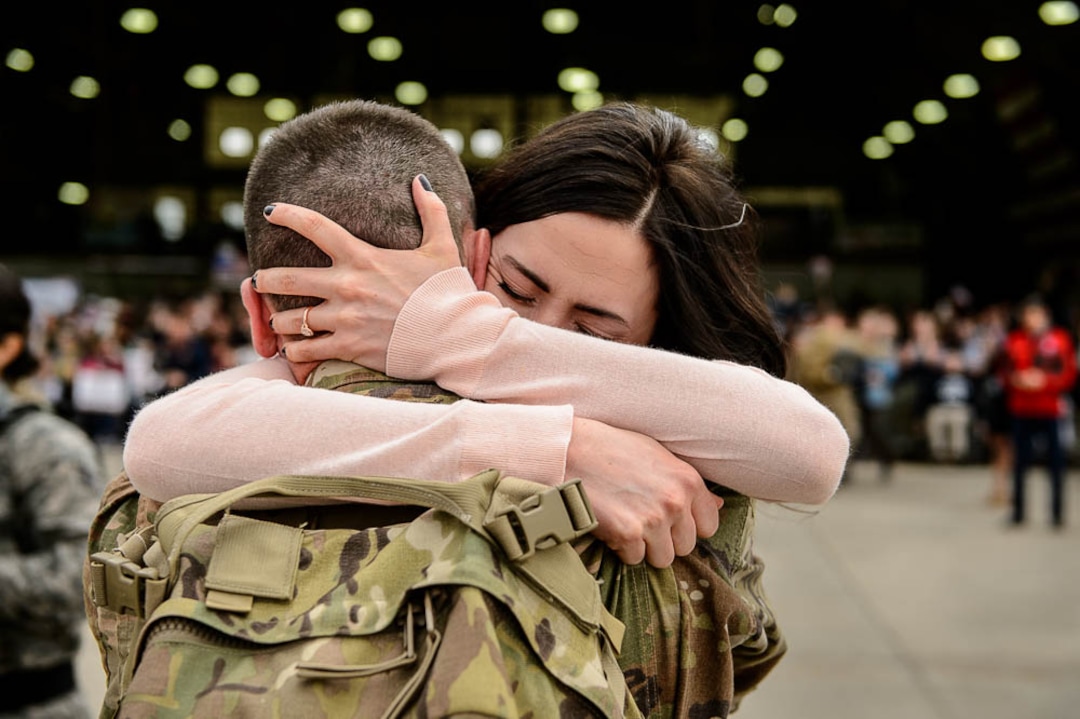 (Trent Nelson  |  The Salt Lake Tribune)  Samantha Taylor embraces her husband, Specialist Alex Taylor, as almost 100 Soldiers from Utah Army National Guard’s Echo Battery, 1st Battalion, 145th Field Artillery, “Big Red” return after a 10-month Middle East deployment, on Tuesday April 9, 2019 at Wright Air Base in Salt Lake City.