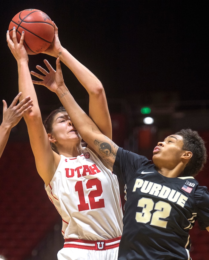 (Rick Egan  |  The Salt Lake Tribune) Utah Utes forward Emily Potter (12) goes up for a shot as Purdue Boilermakers forward Ae'Rianna Harris (32) defends, in basketball action Utah Utes vs. Purdue Boilermakers, at the Thomas M. Huntsman Center, Monday, November 20, 2017.


