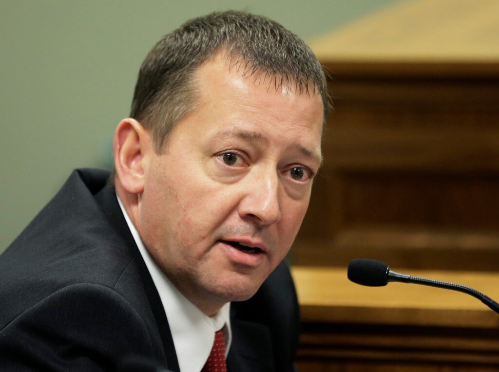 Rep. Paul Ray, of Clearfield, Utah, addresses a committee hearing Wednesday, Nov. 19, 2014, at the Utah State Capitol, in Salt Lake City. Utah lawmakers want to once again allow state executions by firing squad in order to avoid problems with lethal injection drugs. The proposal from Ray would call for a firing squad if the state cannot obtain lethal injection drugs 30 days before a scheduled execution. Ray says he thinks it's the most humane way to kill someone because an inmate dies instantly. (AP Photo/Rick Bowmer) 