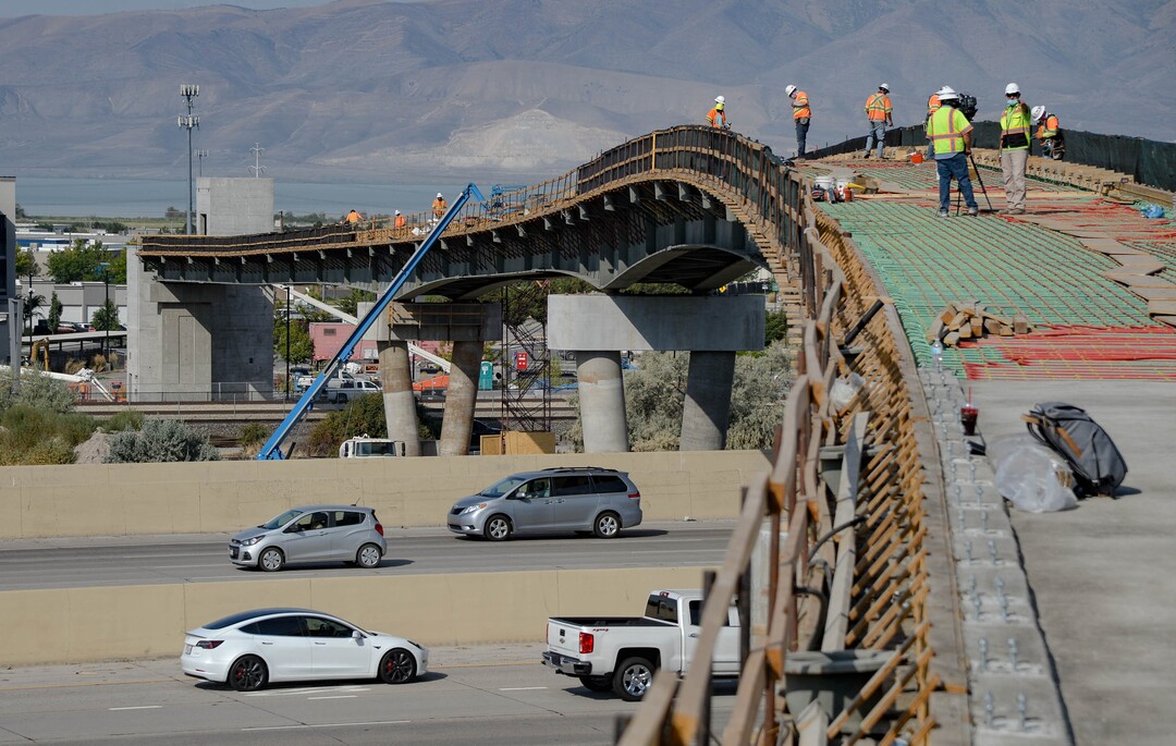 (Francisco Kjolseth  |  The Salt Lake Tribune) UDOT gives a tour of the state’s new longest pedestrian bridge on Thursday, August 20, 2020, connecting Utah Valley University in Orem to student housing and the community on the West side of I-15. Crews are finishing up an extensive hydronic heating system that will pump warm water to keep the bridge clear of snow in the winters, as it gets ready to pour concrete for the walking surface. UDOT will close I-15 in both directions this weekend for work on the nearly 1,000 foot bridge that is 15 feet wide to accommodate pedestrians, cyclists and scooters. Elevators and stairs with small ramps to push up bicycles will be on each side of the bridge.