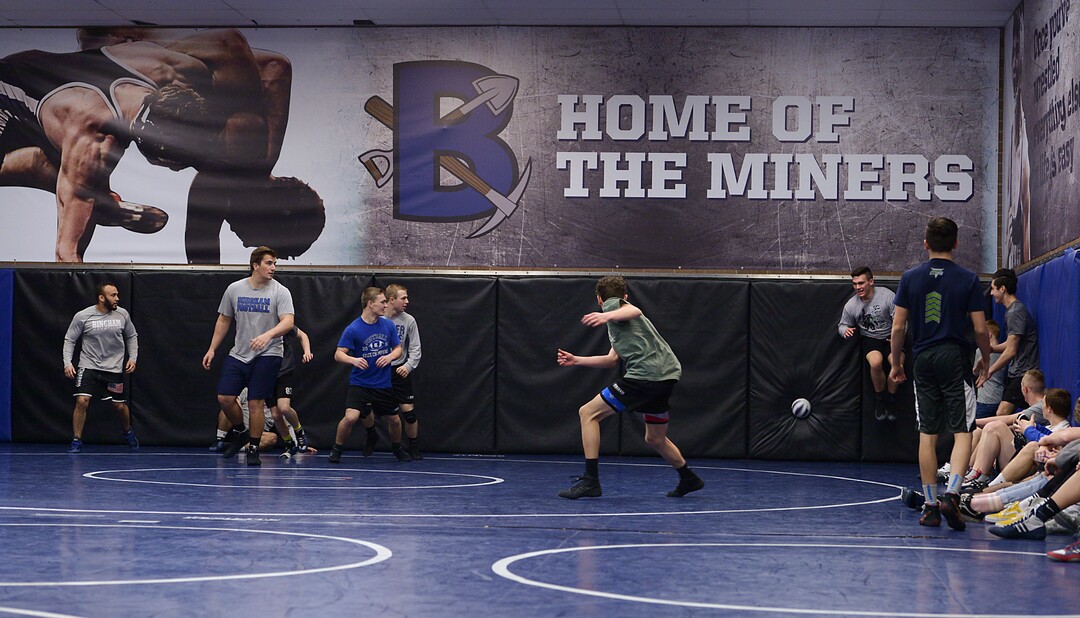 (Leah Hogsten  |  The Salt Lake Tribune)  Bingham High School wrestles warm up with a friendly game of dodge ball in the practice facility after school. 